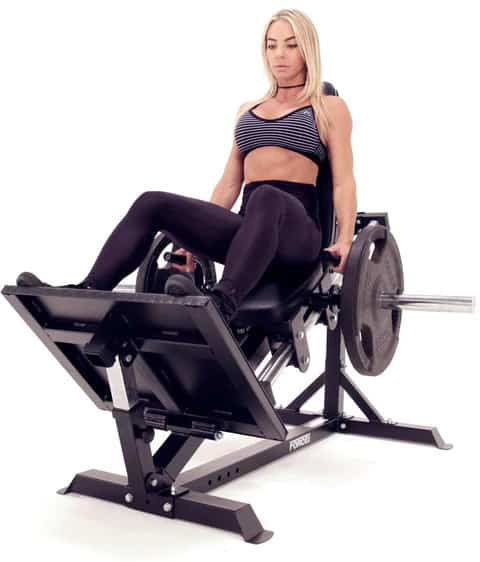 Force USA Compact Leg Press with an athlete